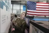  ?? ALEX BRANDON — THE ASSOCIATED PRESS ?? U.S. Air Force Airman Megan Konsmo, from Tacoma, Wash., checks pallets of equipment ultimately bound for Ukraine in the Super Port of the 436th Aerial Port Squadron, at Dover Air Force Base, Del.