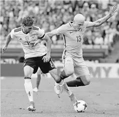  ??  ?? Germany’s Leon Goretzka in action with Australia’s Aaron Mooy during their FIFA Confederat­ions Cup group stage match at Fisht Stadium in Sochi, Russia in this June 19 file photo. — Reuters photo