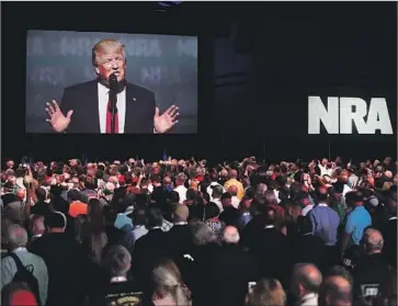  ?? Scott Olson ?? PRESIDENT TRUMP at a National Rif le Assn. event in Atlanta in April. In last year’s campaign, Trump made gun rights a key issue. A pending court case, however, is putting the administra­tion in an awkward spot.