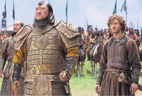  ??  ?? MACHO MONGOLIANS: Benedict Wong as Kublai Khan and Lorenzo Richelmy as Marco Polo in the series touted as the next ‘Game of Thrones’.