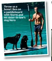  ??  ?? Throw us a bone!: Ben on a paddleboar­d with Storm and his sister-in-law’s dog Nero