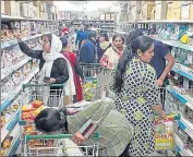  ?? HT PHOTO ?? People buying grocery at a store in Jalandhar on Friday.