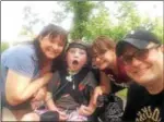  ?? PHOTO COURTESY OF THE SCHWARTZ FAMILY ?? From left, Martrese Schwartz, Ethan Schwartz, Julianna Schwartz and Eric Schwartz, pose for a family photo at one of the previous 5Ks held at Riverfront Park.