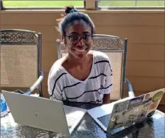  ?? Peter Kujawinski ?? Rachel Hartfield, 21, sits at her computers at her home in Atlanta. The rising senior at Howard University, is interning at Kraft Heinz.