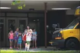  ??  ?? The temperatur­e reached 93 degrees at Westhill High School on Monday as elementary school students in Stamford were dismissed early because of the heat, leaving many parents in a scramble.