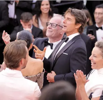  ?? ?? Thierry Frémaux and Tom Cruise walk the Cannes carpet in 2022.