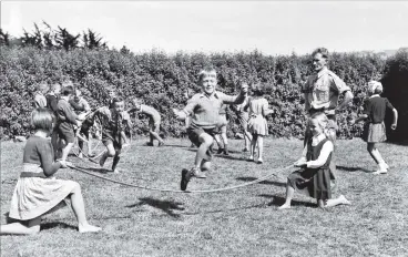  ?? PHOTO: ODT IMAGES ?? Skipping water . . . Playtime at Andersons Bay School in the old days, a dangerous business in the era before bottled water.