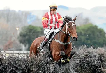  ?? RACING IMAGES ?? Just Ishi and Gary Walsh clear a fence during the running of the Hawke’s Bay Steeplecha­se at Hastings yesterday.