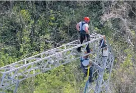  ?? Ramon Espinosa Associated Press ?? WHITEFISH ENERGY Holdings, a firm with only two full-time employees when Hurricane Maria hit Puerto Rico, has sent several hundred workers to the island.