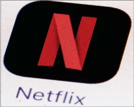  ?? ASSOCIATED PRESS ?? THIS JULY 17 FILE PHOTO shows the Netflix logo on an iPhone in Philadelph­ia. Much of the attention showered on Netflix focuses on its insatiable appetite for original content. But this streaming network’s multi-billion-dollar annual outlay for new...