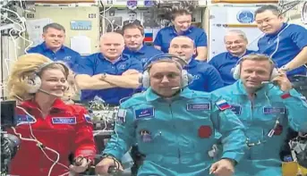  ?? ?? Actress Yulia Peresild, in red, aboard the Internatio­nal Space station on Tuesday.
