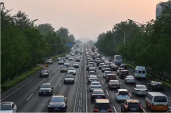  ??  ?? Vehicles on the Second Ring Road in Beijing on April 30. A new regulation on preventing and controllin­g emissions from automobile­s and non-road mobile machinery went into effect the next day