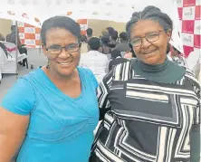  ?? Picture: GILLIAN McAINSH ?? FRUITS OF THE YEAR: Teachers Ntuthu Ncoyo, left, and Thozama Xakaxa congratula­ted matric girls for completing the Vision4 Women mentoring programme last week in Walmer