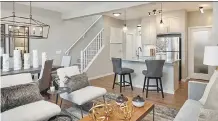  ??  ?? The open-concept main level in the Colorado show home by Calbridge Homes in Fireside is a bright and welcoming space.