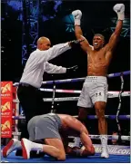  ??  ?? FLOORED: Joshua fells Klitschko