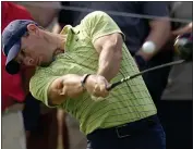  ?? ERIC GAY — THE ASSOCIATED PRESS ?? Rory McIlroy hits his tee shot on the 16th hole during the first round of the PGA Championsh­ip on Thursday in Tulsa, Okla.