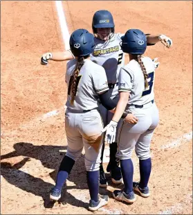  ?? PHOTO SPECIAL TO THE O-N-E/ DENISE ARCHETTO ?? Spartans’ Delaney Cumbie (2) hugging Makenna Matthijs (11) and Maycin Brown (3) after her home run against the Pirates on Sunday, April 24.