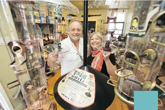  ?? PHOTOS: WAYNE CUDDINGTON ?? Bob Volks and Louise Beckinsale have opened a new store in Ottawa for all things bird — whimsical birdhouses, hummingbir­d feeders, bird puppets, books, puzzles and lots more. It’s the second location for the owners — their first was in Almonte.