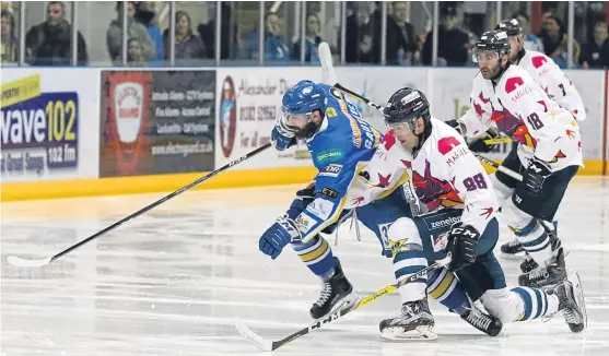  ?? Picture: Derek Black. ?? Stars’ Brian Hart battles with Flyers’ Danick Gauthier at Dundee Ice Arena last night.