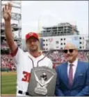  ?? ALEX BRANDON — THE ASSOCIATED PRESS ?? Washington’s Max Scherzer, left, waving after receiving the National League Cy Young Award from Nationals general manager Mike Rizzo before Monday’s opener at Nationals Park in Washington, will oppose the Phillies in Friday’s home opener.