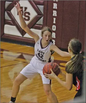  ?? Terrance Armstard/News-Times ?? Armed for defense: West Side Christian's Lauren Land plays defense against Garrett Memorial this season. The 6-foot-1 senior has played all five positions for the Lady Warriors this season.