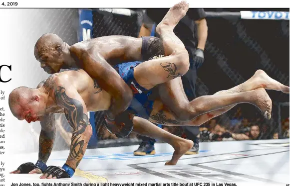  ?? AP ?? Jon Jones, top, fights Anthony Smith during a light heavyweigh­t mixed martial arts title bout at UFC 235 in Las Vegas.