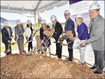  ?? HYOSUB SHIN PHOTOS / HSHIN@AJC.COM ?? Alan Hallman (sixth from left), mayor of Hapeville, and other city officials participat­e in a ceremonial groundbrea­king for a Solis hotel on April 5. The developmen­t of the highend hotel next to the Porsche North America headquarte­rs is raising hopes...