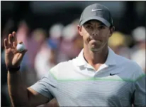  ?? — GETTY IMAGES ?? Tournament leader Rory McIlroy reacts after his birdie on the 15th hole at the Wells Fargo Championsh­ip on Saturday.