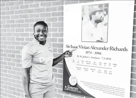  ??  ?? SEEKING INSPIRATIO­N! Captain Stafanie Taylor admires a portrait of former West Indies captain Sir Vivian Richards during the team’s training at Taunton. (photo courtesy of CWI)