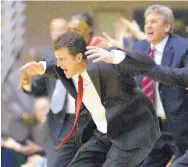  ?? DINO VOURNAS/AP FILE ?? Coach Steve Alford, left, with assistant Craig Neal behind him, react to a call during an NIT game against California in 2008.