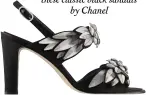  ??  ?? Camellia flower details add a contempora­ry twist to these classic black sandals by Chanel