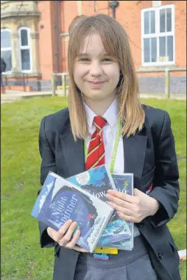  ??  ?? Erin Wassell, a year eight student at Hinckley Academy and john Cleveland Sixth Form centre, wrote to author Abi Elphinston­e after a flood destroyed the school’s library. The author sent signed copies of her books to help cheer Erin and her classmates up. Erin is pictured with the signed books and the letter she sent to Abi. Pictured by Hinckley Academy and john Cleveland Sixth Form centre