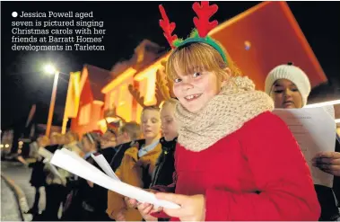  ??  ?? Jessica Powell aged seven is pictured singing Christmas carols with her friends at Barratt Homes’ developmen­ts in Tarleton