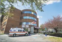  ?? Hearst Connecticu­t Media file photo ?? An ambulance used to transport a patient is parked outside a nursing home in Bridgeport.