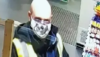 ??  ?? Chilling: Robson in a skull mask on a service station’s CCTV after the murder