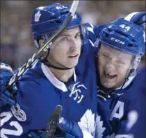  ?? CHRIS YOUNG, THE CANADIAN PRESS ?? Toronto Maple Leafs’ Tyler Bozak, left, is playing some of his best hockey at age 30, inspired and pushed by new group of young stars.