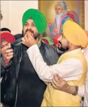  ?? PTI ?? New Punjab CM Charanjit Singh Channi (right) celebrates with Congress state unit president Navjot Singh Sidhu on Monday.