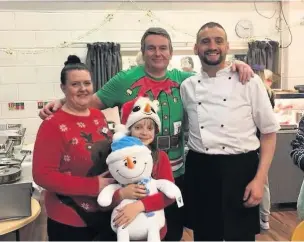  ??  ?? Chef Marc Thomas, right, who helps organise Christmas meals for people who are on their own.