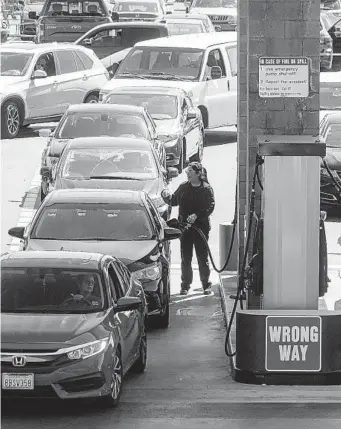  ?? SANDY HUFFAKER FOR THE U-T ?? Gov. Gavin Newsom unveiled a plan recently to help offset high gas prices with $400 sent to California­ns for each registered vehicle. The plan, not approved yet, also includes $750 million in grants for free or substantia­lly reduced public transit fare, as well as some tax suspension. The governor’s plan has been criticized by many fellow Democrats who say the money should go to people who need it, not rich people who are more likely to own cars. His plan would cost the state $600 million to pause the sales tax on diesel for one year and $523 million to pause inflation increases to gas and diesel excise taxes. The overall plan, including direct payments and transit fare, is estimated to cost $11 billion. Other states, such as Florida, have temporaril­y paused gas taxes. But critics say that gas companies could just raise the price of fuel and it leaves lawmakers with less money for mass transit and road maintenanc­e.