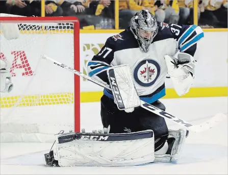  ?? CANADIAN PRESS FILE PHOTO ?? Winnipeg’s Connor Hellebuyck had an excellent run last year, taking Winnipeg deep into the playoffs and earning a Vezina Trophy nomination. The six-foot-four, 207-pound American is 25 years old and looks to be just moving into the prime of his National...
