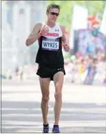  ?? — GETTY IMAGES ?? Dylan Wykes of Canada approaches the finish line in a men’s marathon. Recreation­al runners can follow their example by preparing well in advance — both mentally and physically — for race day.