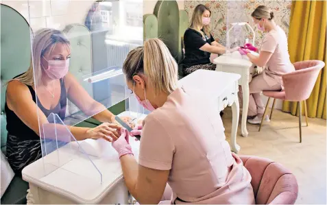  ??  ?? Nail bars will be able to reopen as long as safety precaution­s are followed, but many treatments at beauty salons will remain banned