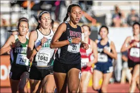  ?? TAMIR KALIFA / AMERICAN-STATESMAN ?? Bowie senior Carolyn Evans won the first heat of the 1,600 meters with a school-record time of 5:05.54. Evans ended up finishing eighth.