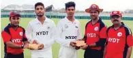  ?? – Supplied photo ?? TOP PERFORMERS: NYDT officials honour Faraz Ismail Al Balushi and Ubaid Ullah.