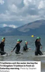  ?? Kelleghan. Photo by Stephen ?? Triathlete­s exit the water during the Tri Kingdom Triathlon in Fenit on Saturday morning.