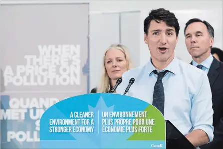  ?? NATHAN DENETTE THE CANADIAN PRESS ?? Prime Minister Justin Trudeau speaks to the media and students at Humber College about his government's new carbon tax in Toronto on Tuesday.