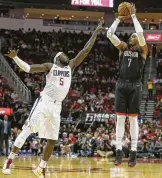  ?? Yi-Chin Lee / Staff photograph­er ?? With Carmelo Anthony, right, and friends firing away at will, the Rockets still lead in 3-point tries but have a lot of company these days.