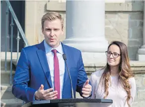  ?? — THE CANADIAN PRESS ?? “Indeed we’re still the government and I’m still the premier until we lose the confidence of the house,” Brian Gallant said — shown with wife Karine Lavoie — after meeting with Lt.-Gov. Jocelyne RoyViennea­u in Fredericto­n on Tuesday.