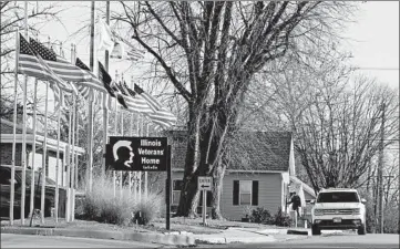  ?? ANTONIO PEREZ/CHICAGO TRIBUNE ?? Flags fly at the Illinois Veterans’ Home in LaSalle on Dec. 3.