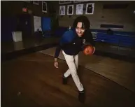  ?? Robert Bumsted / Associated Press ?? Johnuel “Boogie” Fland shoots hoops in the gymnasium of Archbishop Stepinac High School in White Plains, N.Y. on May 2. Fland is among a growing number of high school athletes who have signed sponsorshi­p deals for their name, image and likeness, following a Supreme Court decision last year that allowed similar deals for college athletes.